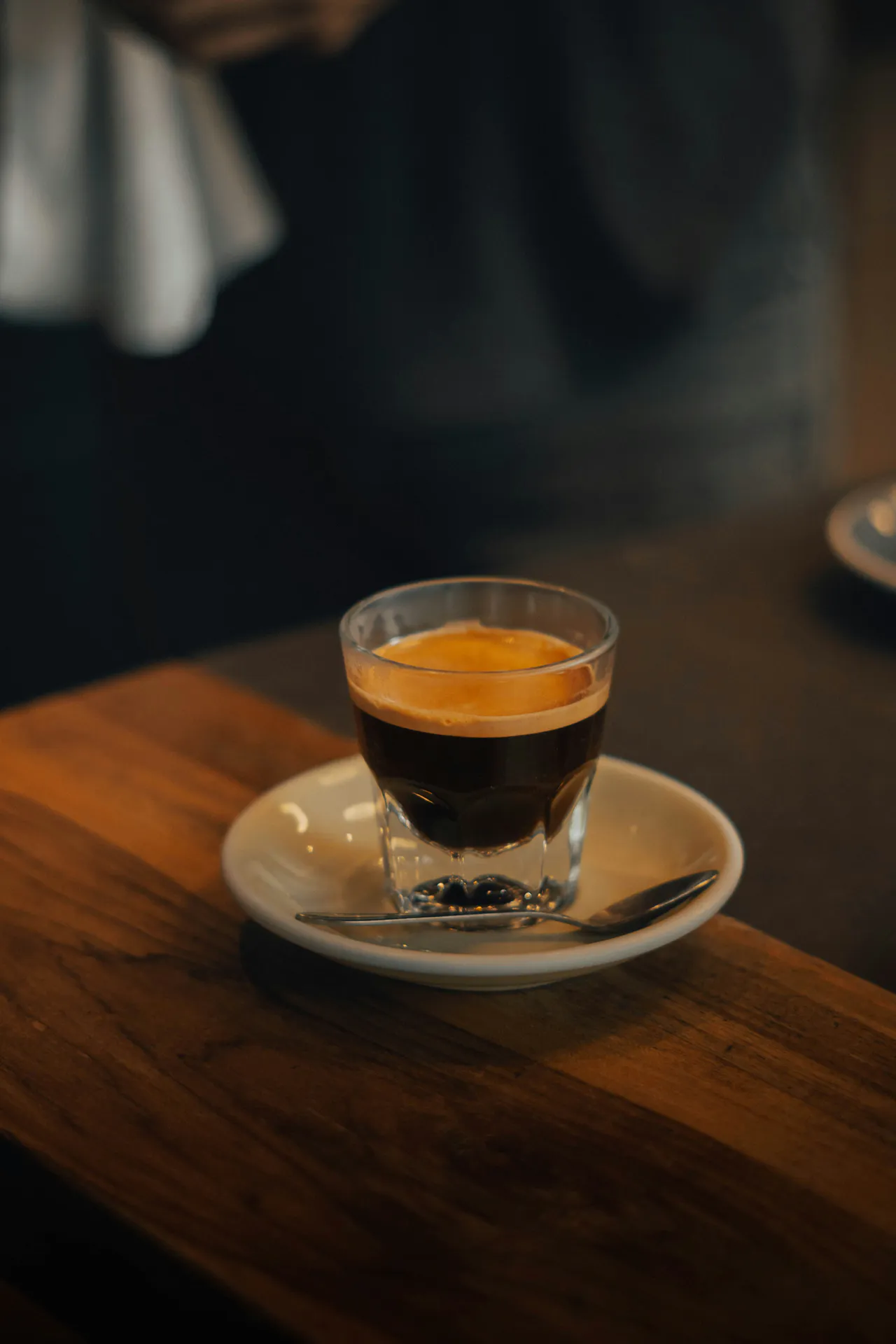 A glass of coffee and saucer in Costa Rica.