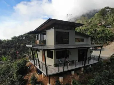 Modern Country House With Guest Cottage Amidst A Coffee Plantation